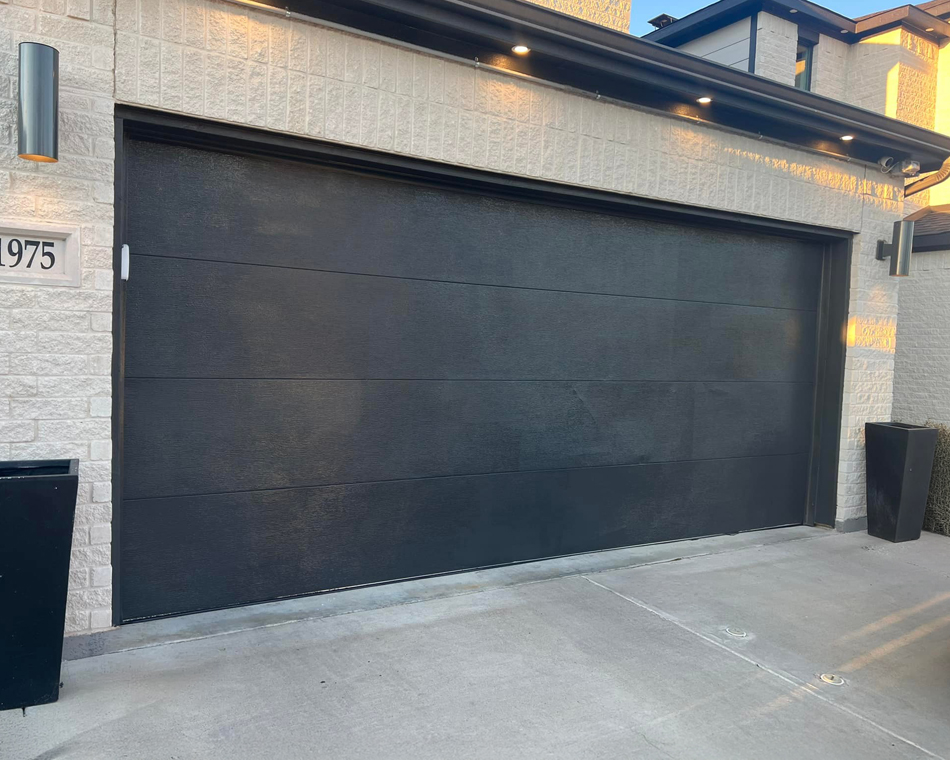 Professional residential garage door installation showing modern design